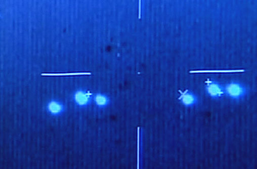 1. Image made from a video shows unidentified flying objects 
<br />in  the skies over southern Campeche state filmed by Mexican Air Force  
<br />pilots, in 2004. The tape shows the bright objects, some sharp points of
<br />  light and others like large headlights, moving rapidly in what appears
<br />  to be a late-evening sky.