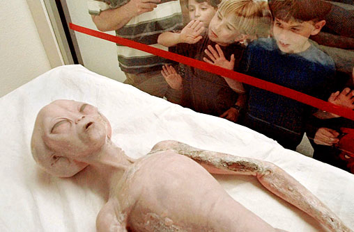 6. Children inspect a model of an alien on display inside International UFO Museum & Research Centre, Roswell, New Mexico